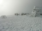 White out on the summit; Jim is the tall person on the right