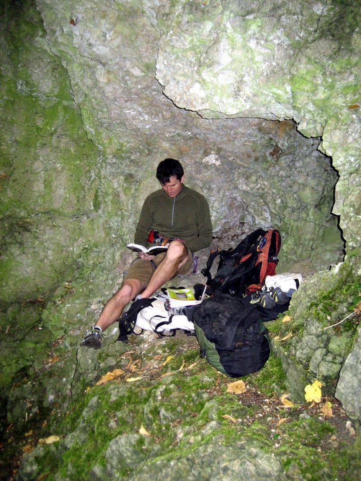 Hiding from the rain in a cave at the base of the Napoleon tower