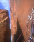 Getting established in the off-width crack above the chimney on the third pitch