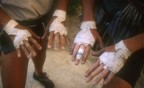 Taped up hands after a day of climbing in the Bighorn Mating Grotto; notice the Disney band-aid on the middle finger