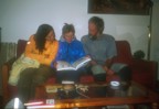 At dinner after climbing at La Cabrera, Lucie and Jen examine Pedro's flying book