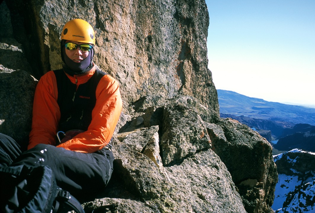 Sitting at a belay high on the route