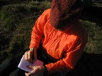 Writing in the journal at camp at the start of the approach