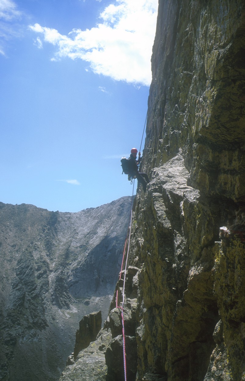 A very exposed rappel from the summit leads into the notch