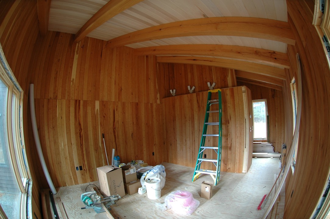 A view of the bedroom closet with the new canister lights installed on the ceiling above