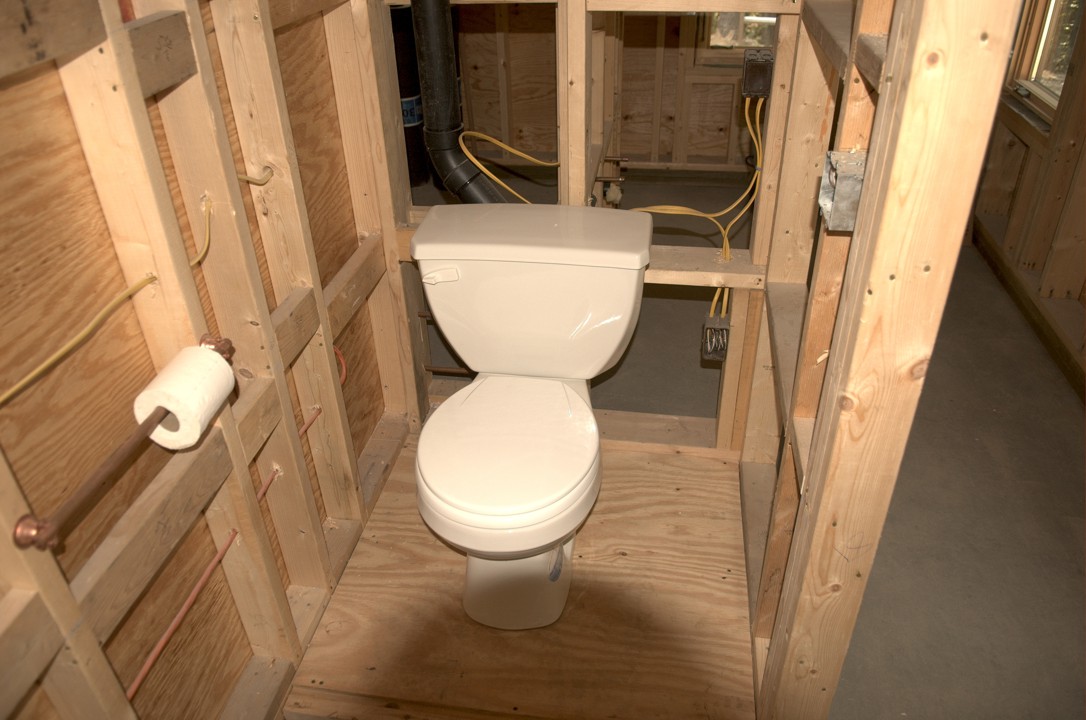 A temporary toilet is installed for the crew