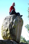 Colin on top of large boulder
