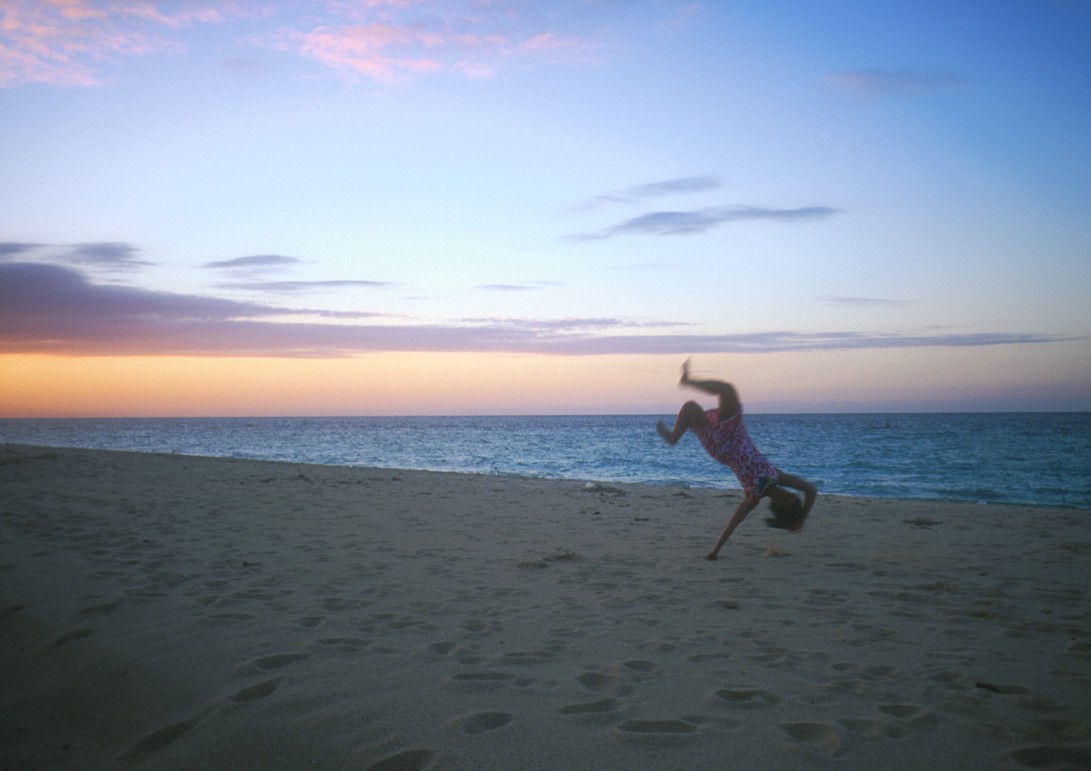 Lucie being blown by the wind at sunset (she's actually doing a handspring)