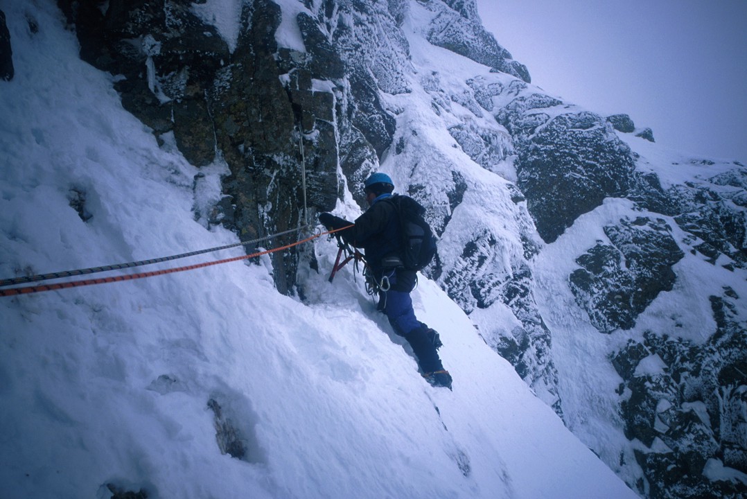 Eric traversing left to the belay at the top of P1