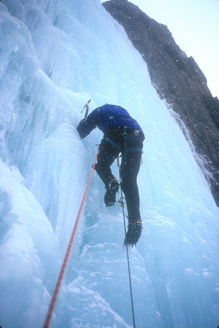 Joe climbs the second pitch (WI4) in a snow squal
