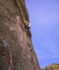Pulling through the initial roof on the second pitch of Mean Mistreator, Mean Mistreator Wall